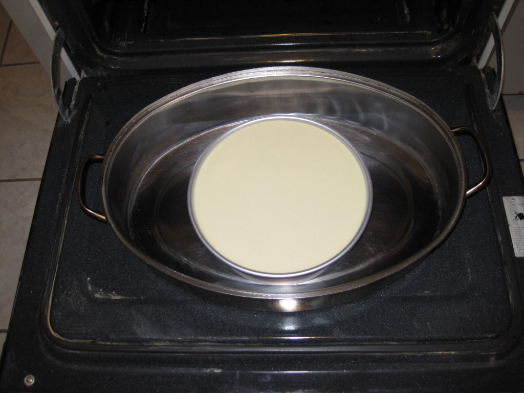 Inside a roasting pan filled with water so it can steam in the oven.