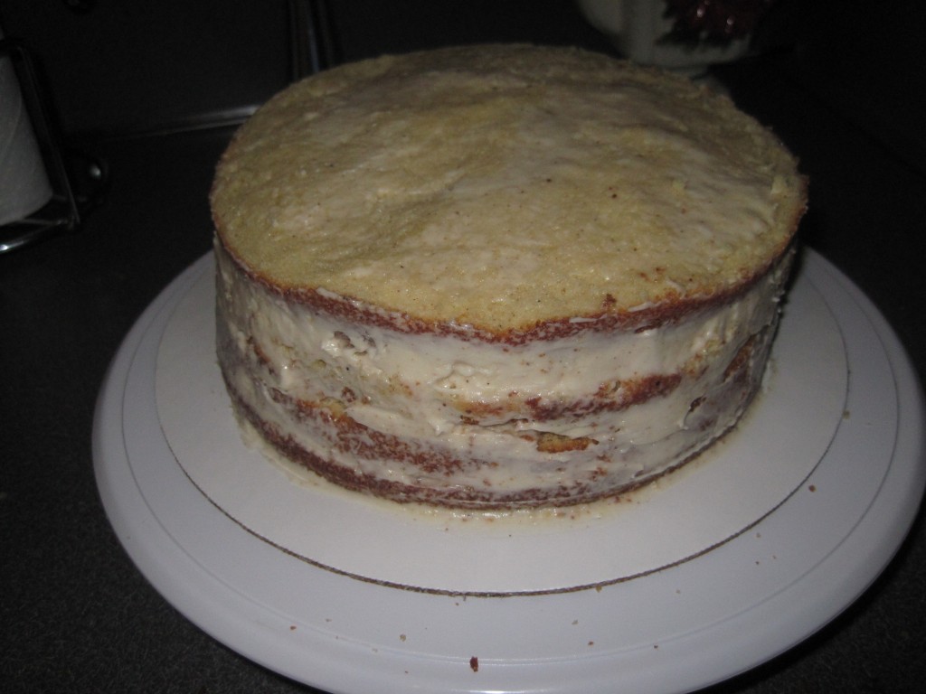 A crumb coat. Note the side has a little thicker frosting to fill in the gaps between the layers of cake.